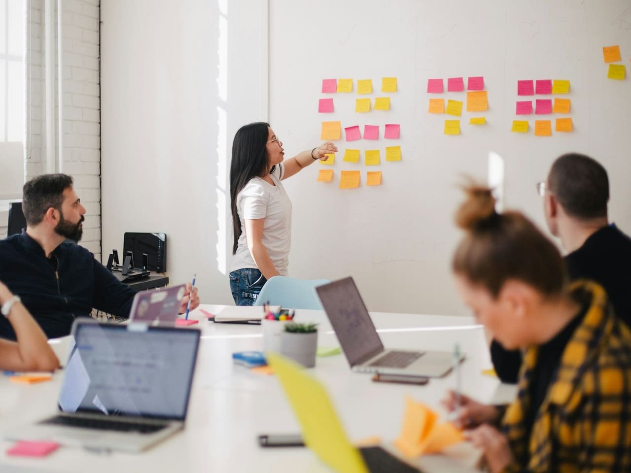 Strategy planning session with notes and charts, representing growth consulting